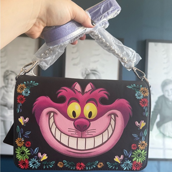Loungefly Handbags - Cheshire Cat loungefly new with tags Disney Floral crossbody